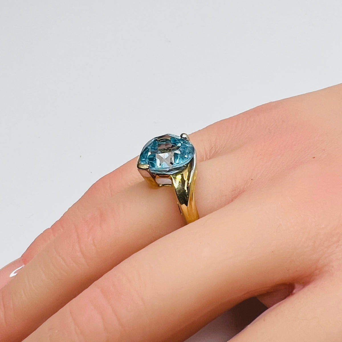 Vintage 10K gold ring with heart-shaped aquamarine gemstone on hand