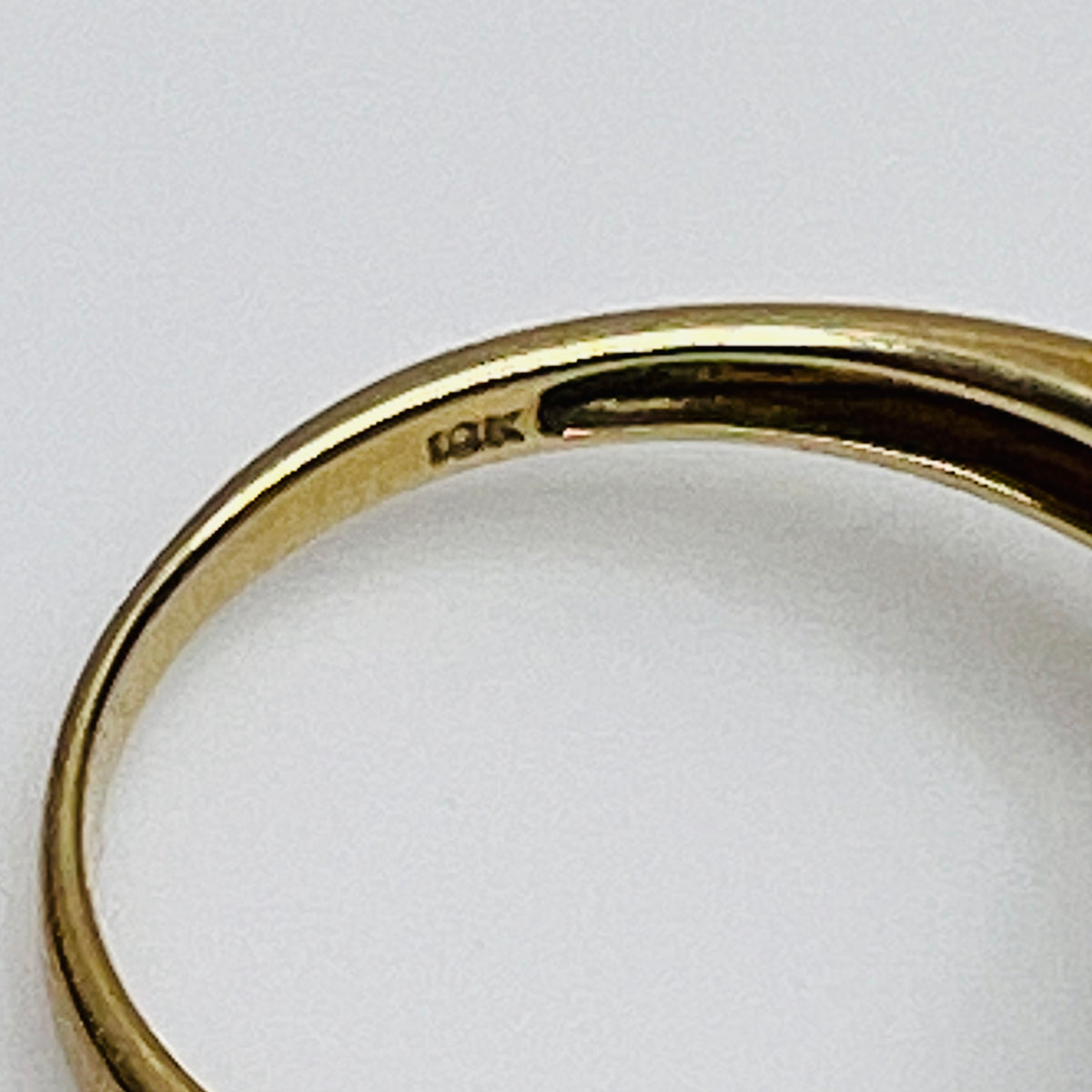 Close-up of aquamarine heart ring in two-tone yellow and white gold