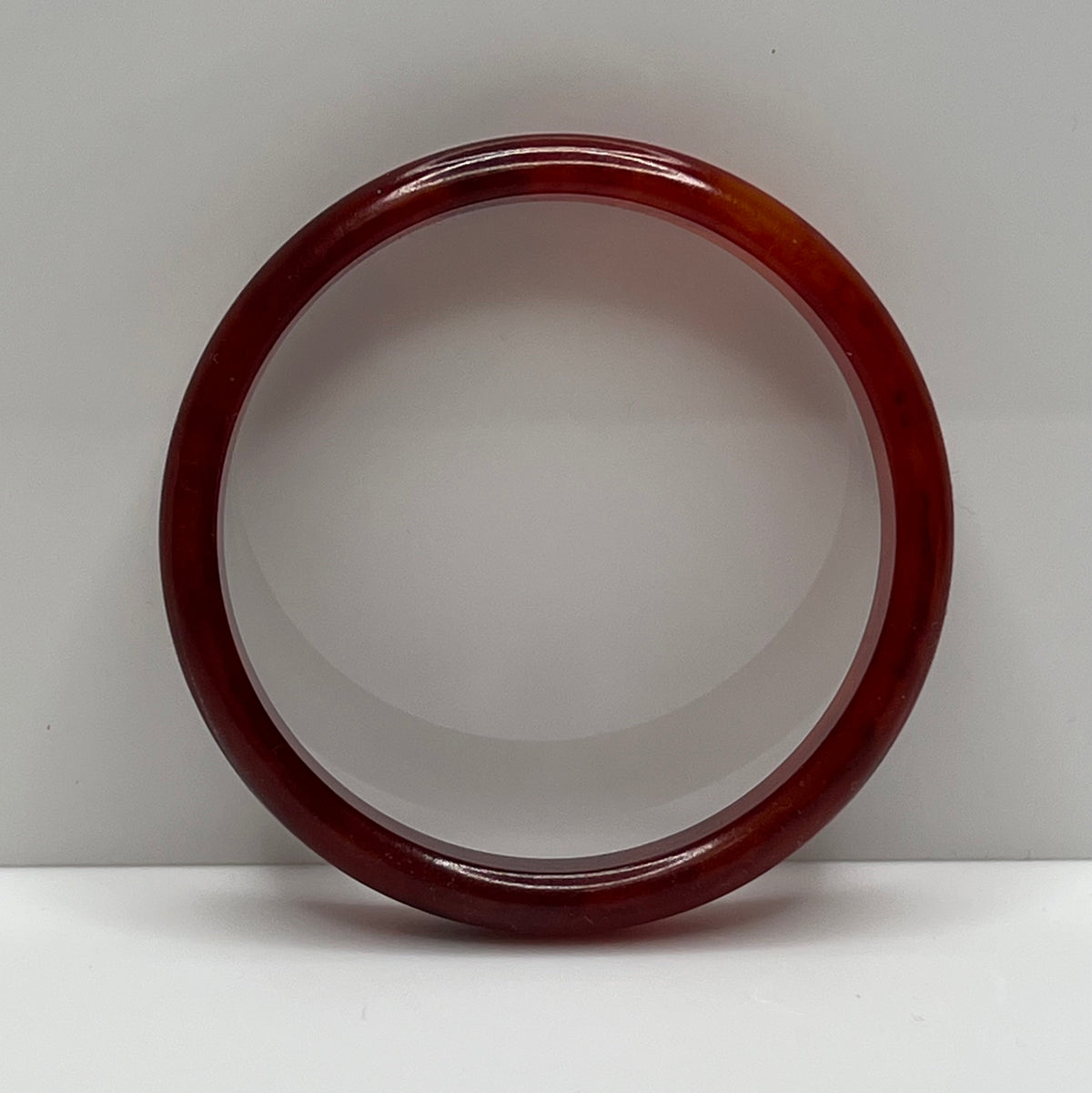 Rounded ½" wide Bakelite bracelet with warm amber swirls