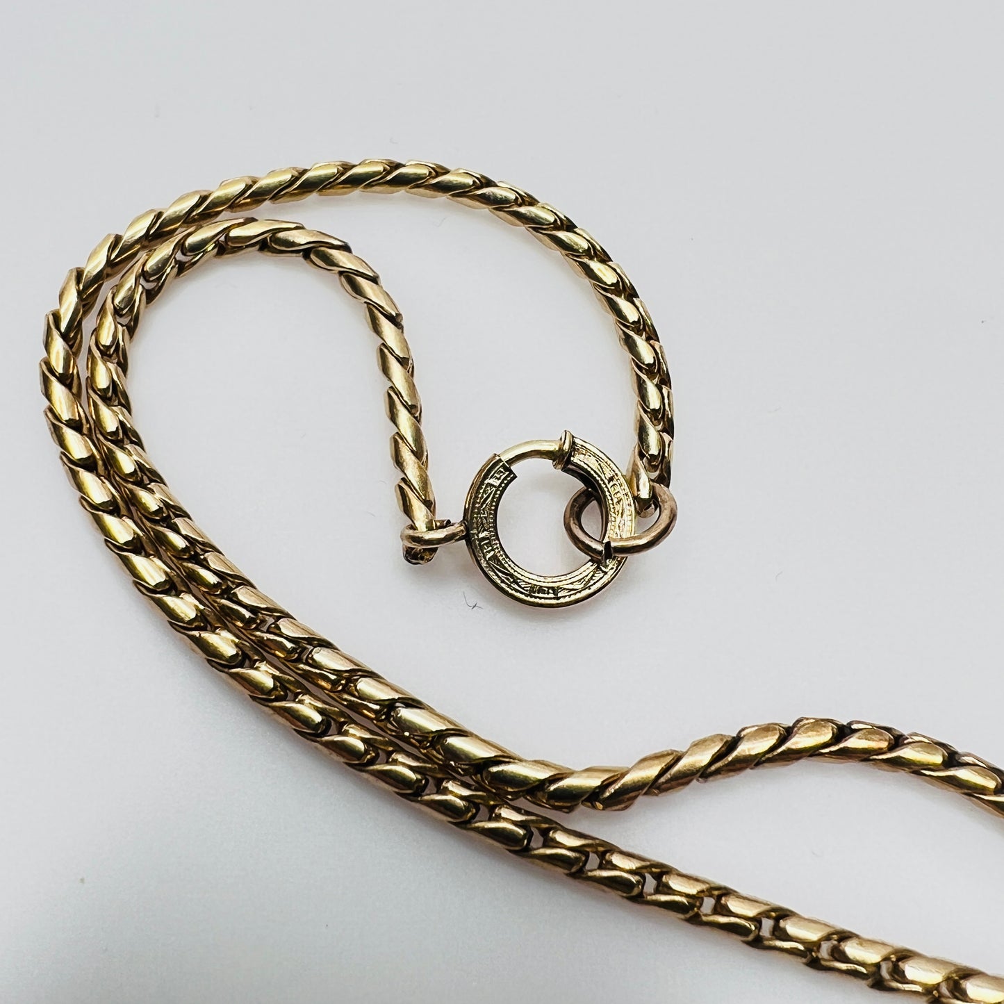 Close-up of gold filled chain and spring ring clasp