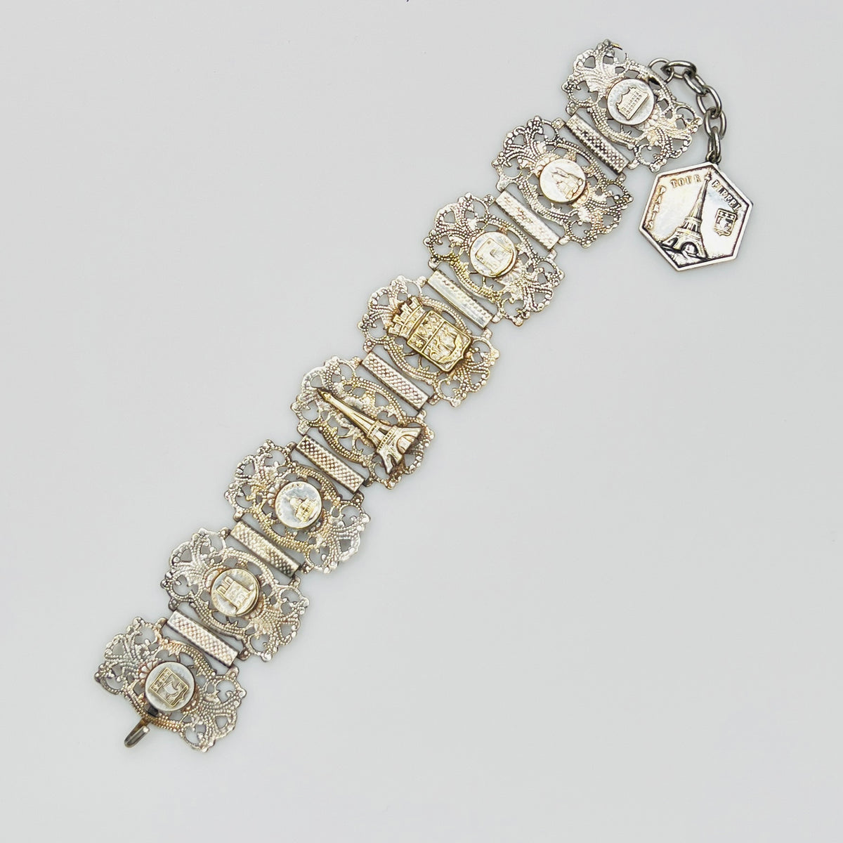 Full view of 1930s Paris souvenir bracelet with charm