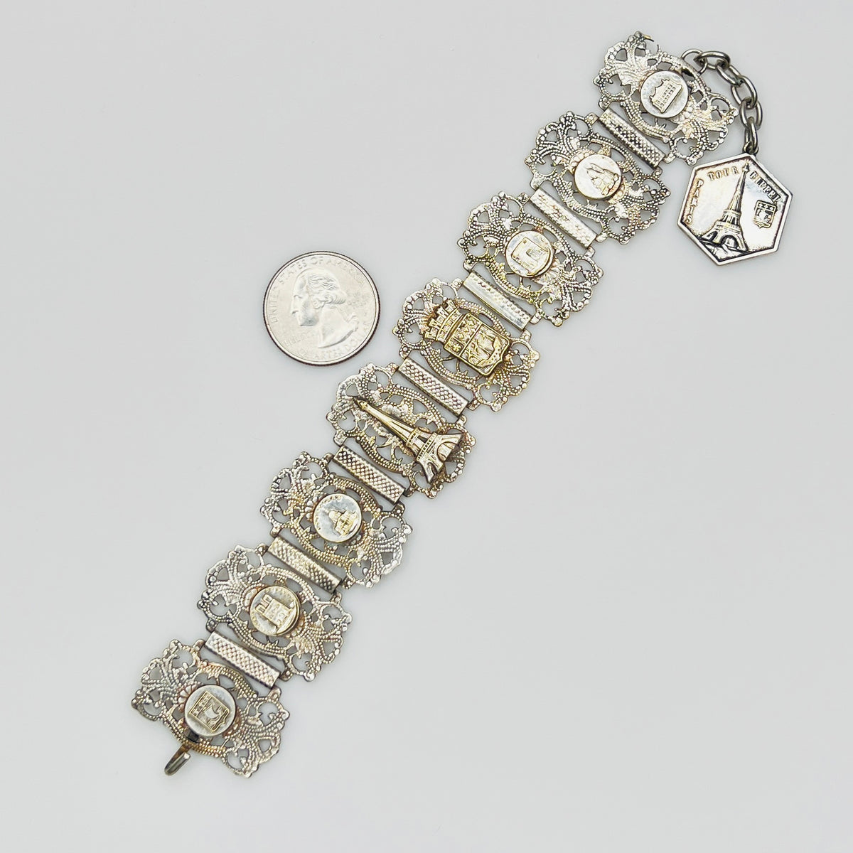 Full view of 1930s Paris souvenir bracelet with charm