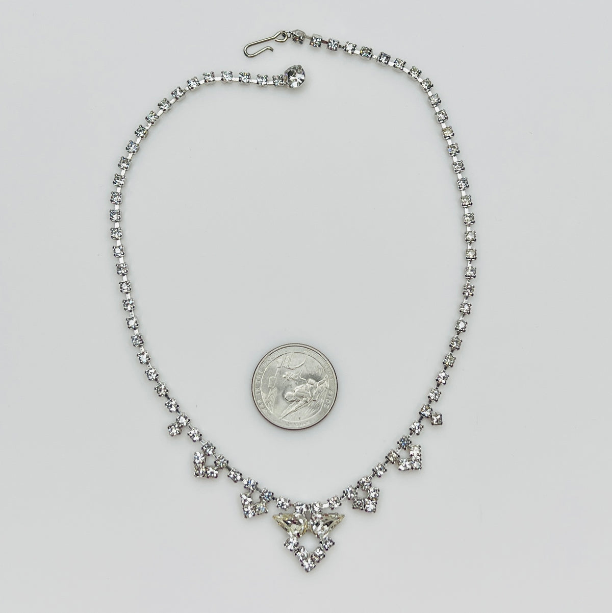 Necklace laid flat showing hook clasp and rhinestone extender