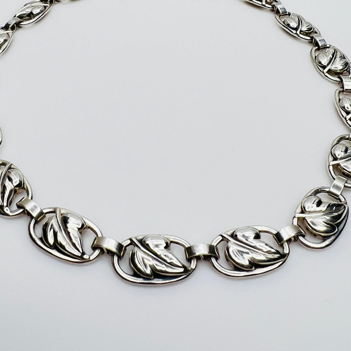 Close up sterling silver leaf link necklace detail
