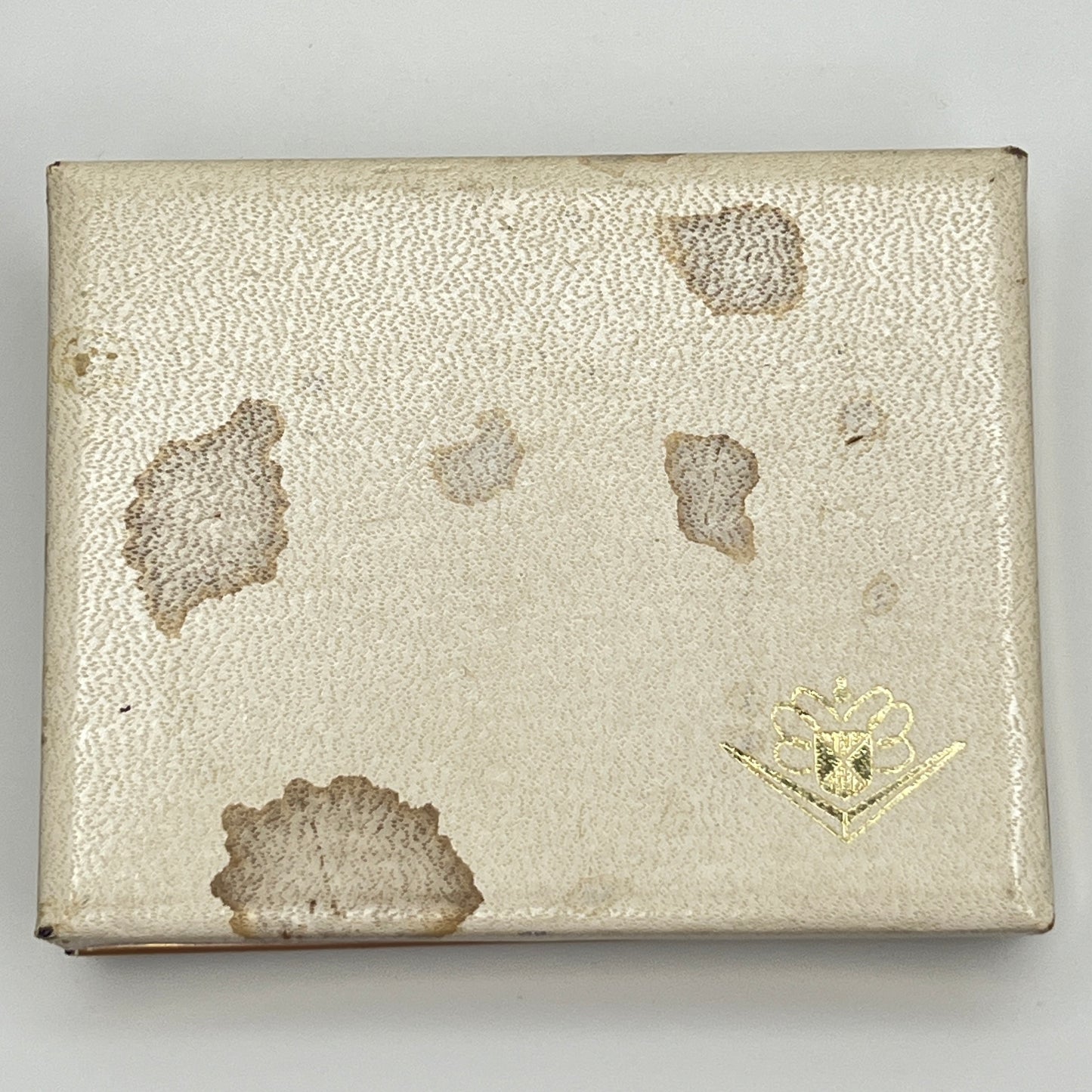 Exterior of vintage Foster box showing staining and wear