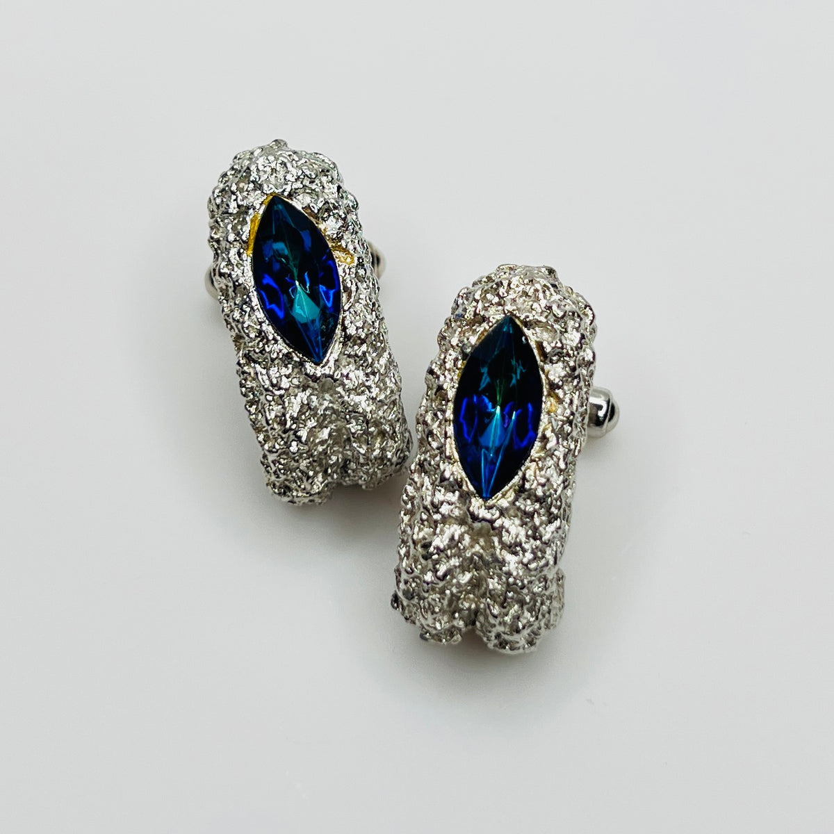 Vintage silver tone cufflinks with blue green crystal navette stones