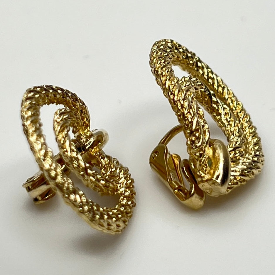 Clip-on earrings with twisted double-loop design