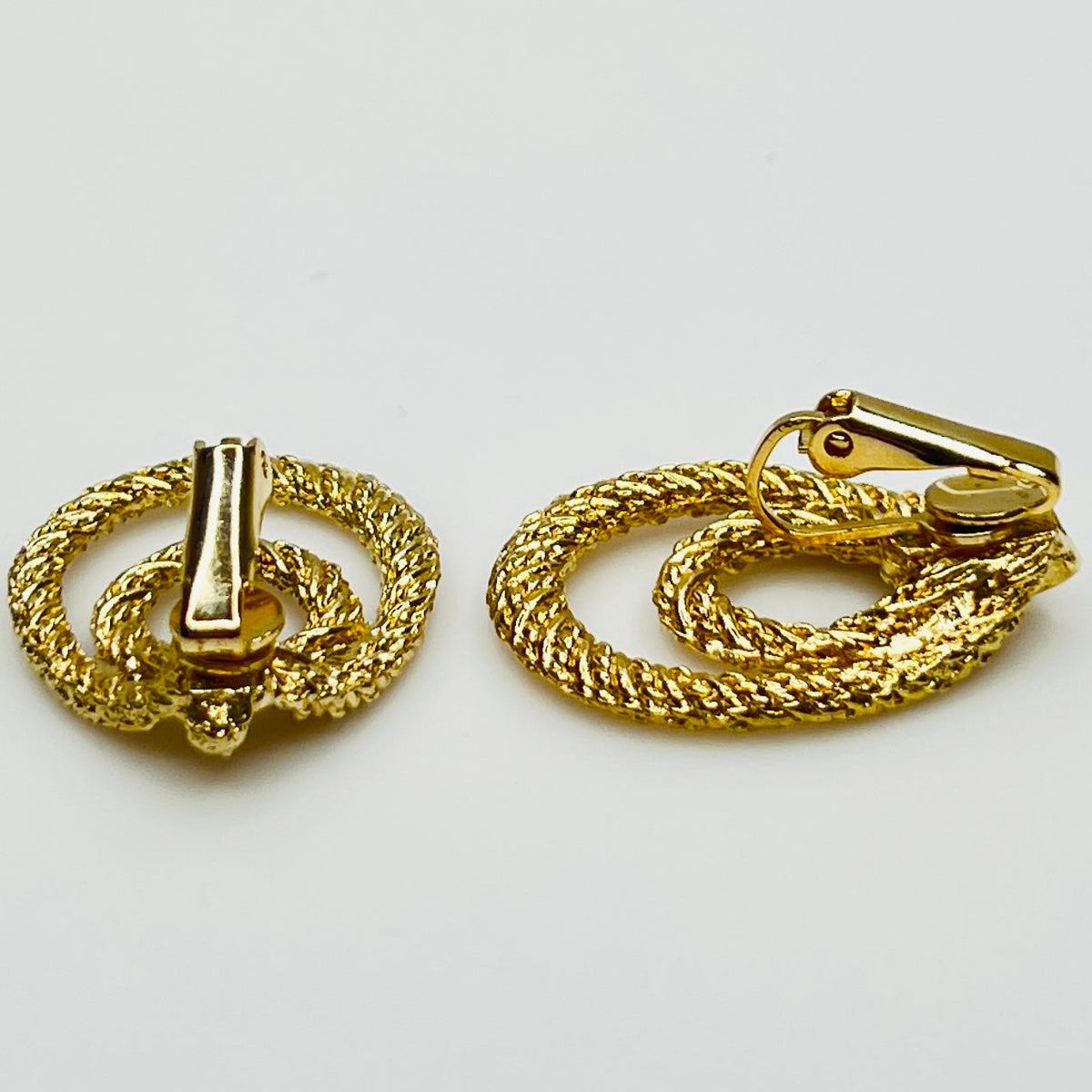 Clip-on earrings with twisted double-loop design