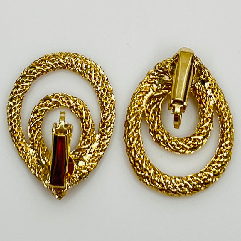 Clip-on earrings with twisted double-loop design