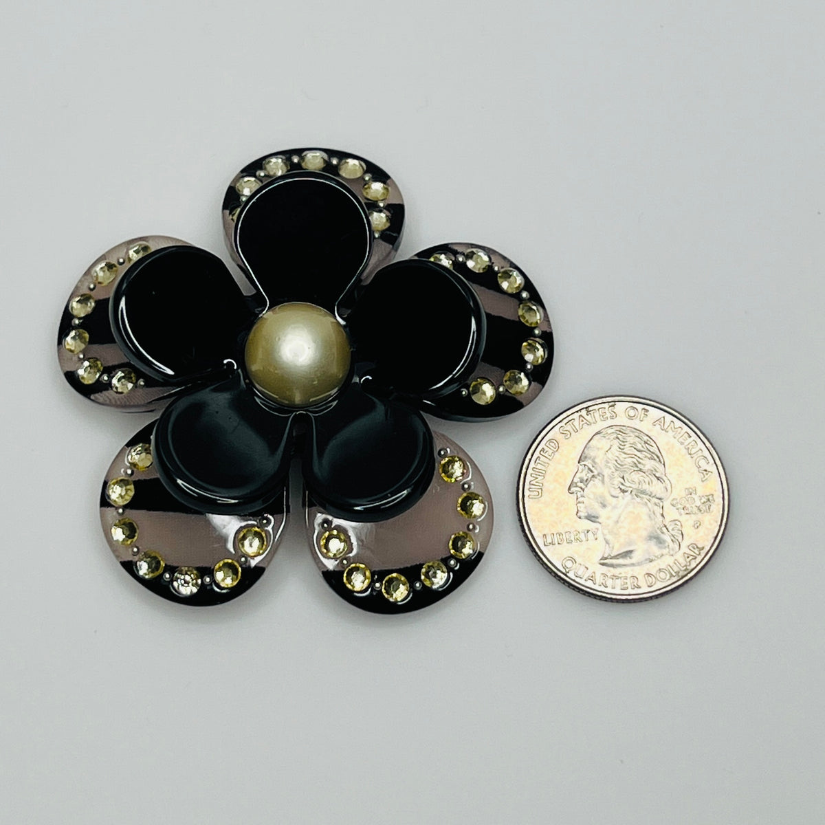 Vintage floral brooch with faux pearl center and groovy style
