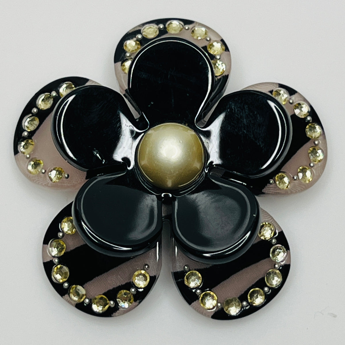 Retro black petal brooch with rhinestone detailing and pin-back