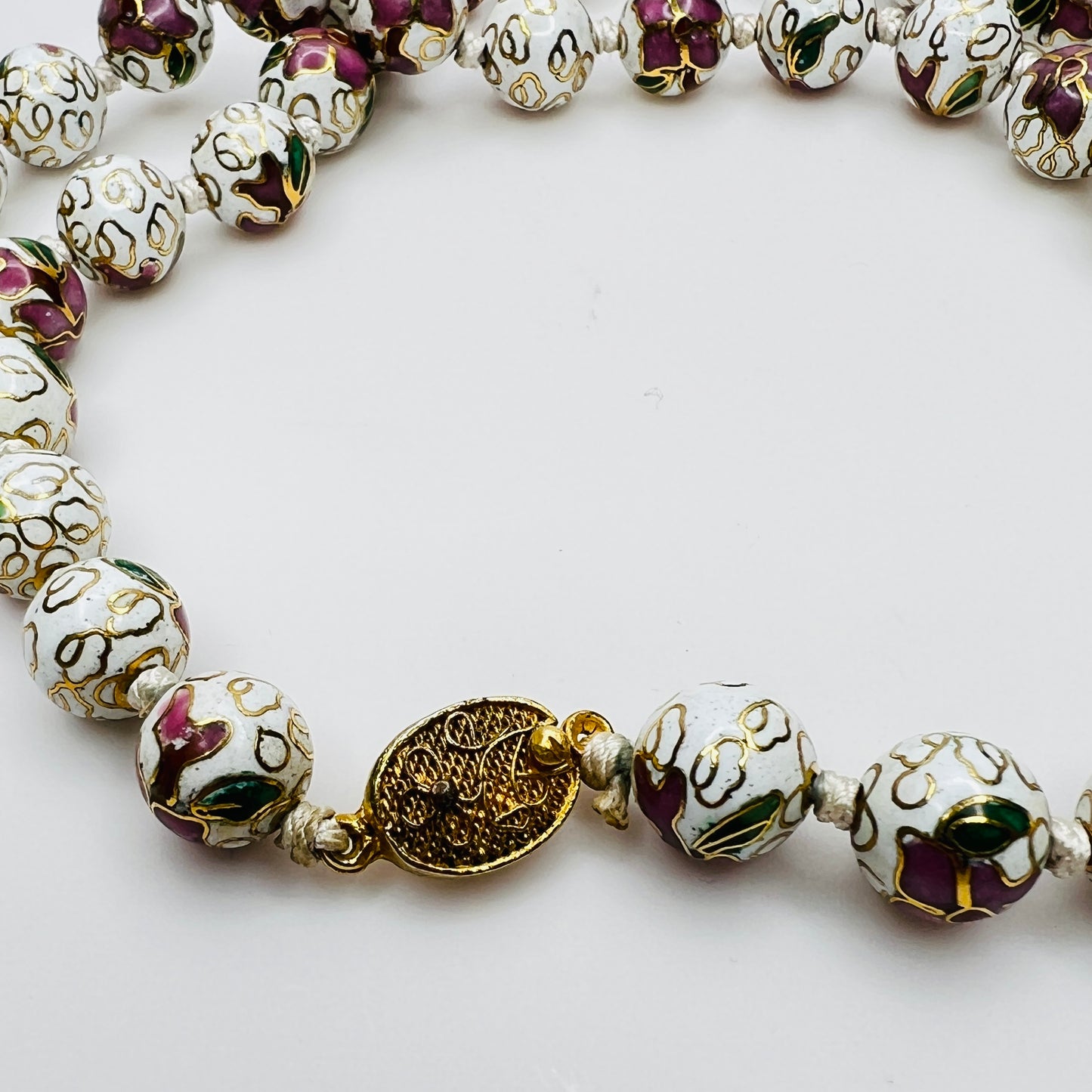 Detailed view of gold-tone filigree box clasp