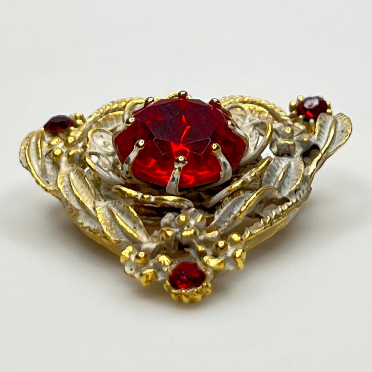 1960s heart-shaped brooch with red rhinestone and white enamel