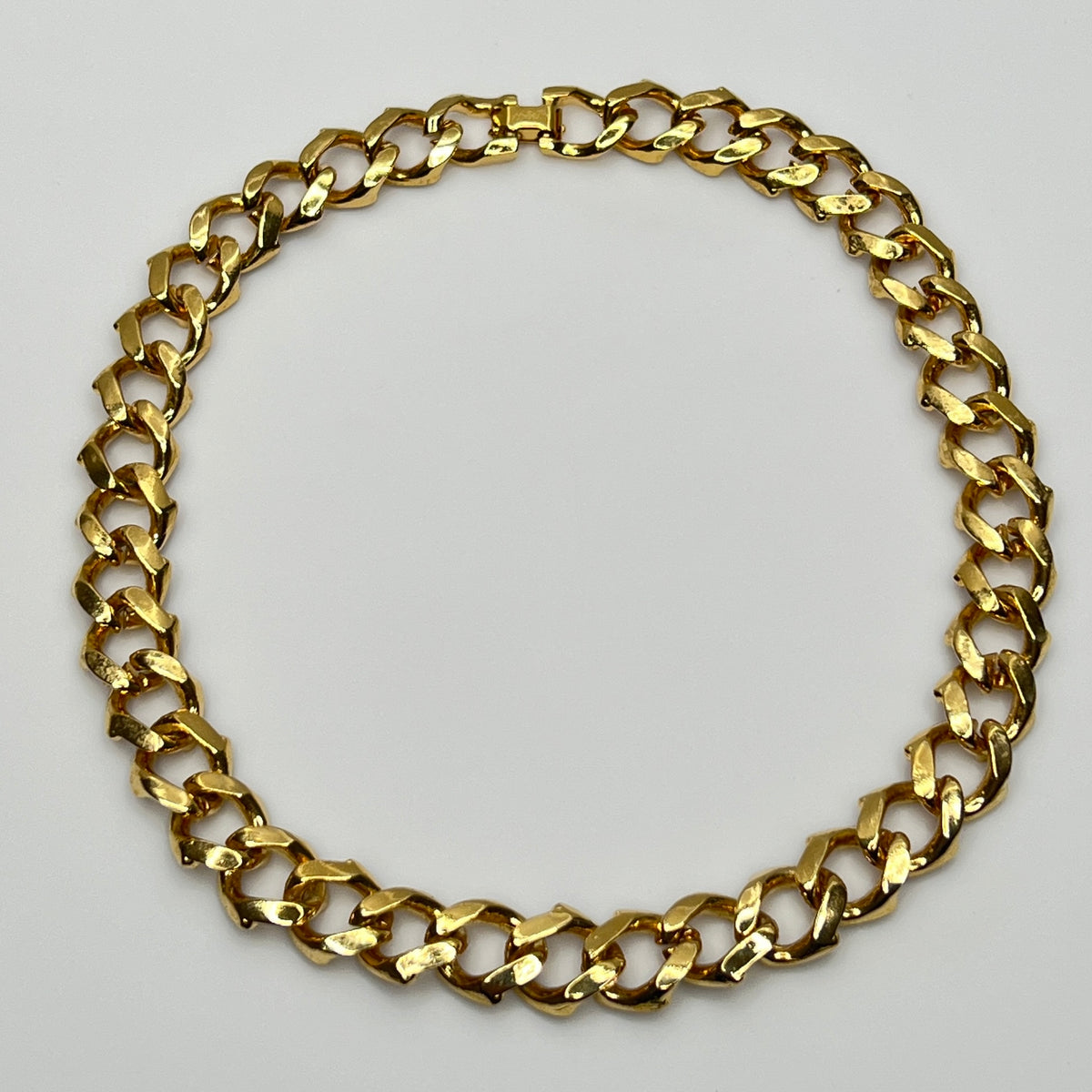 1980s gold-tone chain necklace with brown enamel links and hinge clasp, collar length.