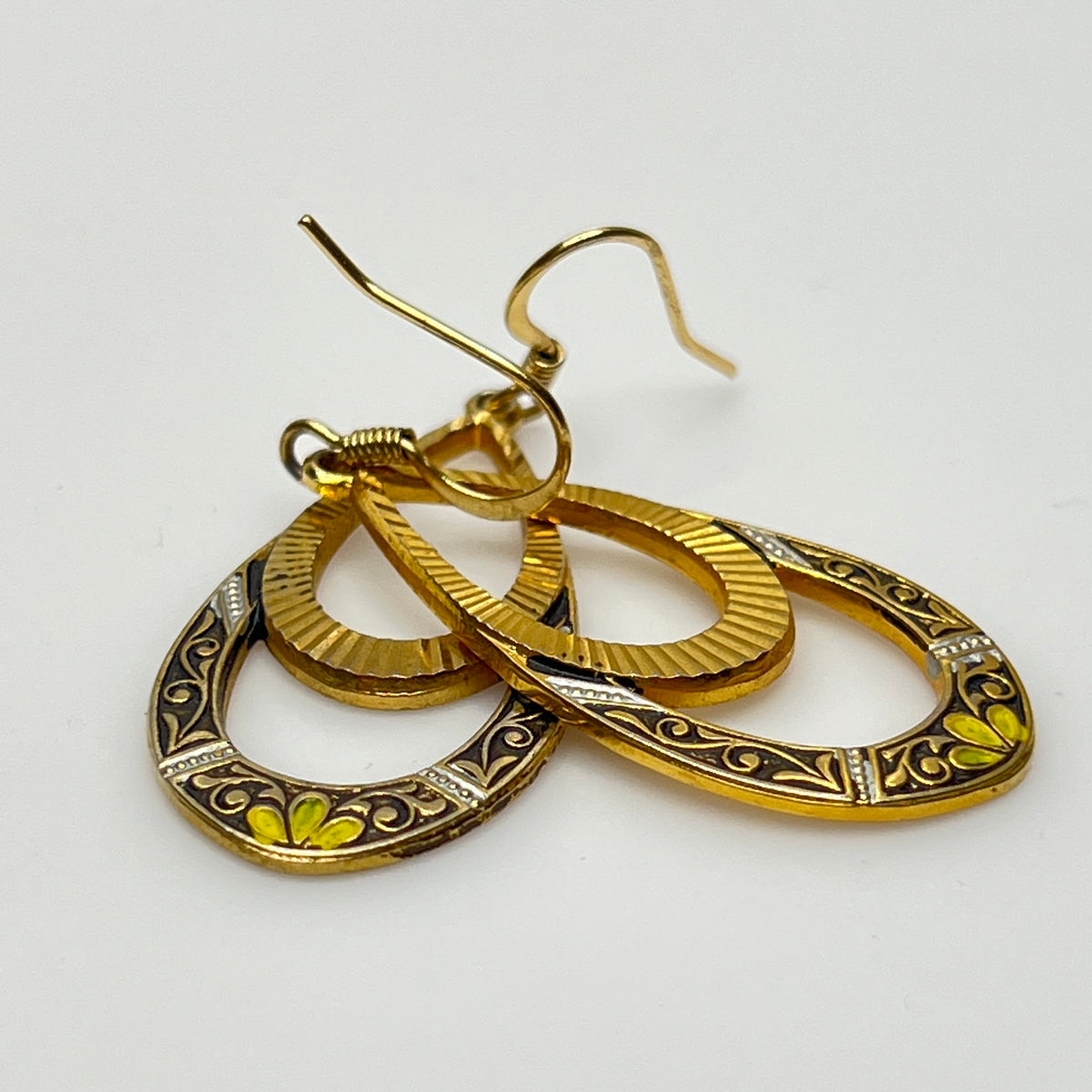 Vintage gold-tone statement earrings with floral accents