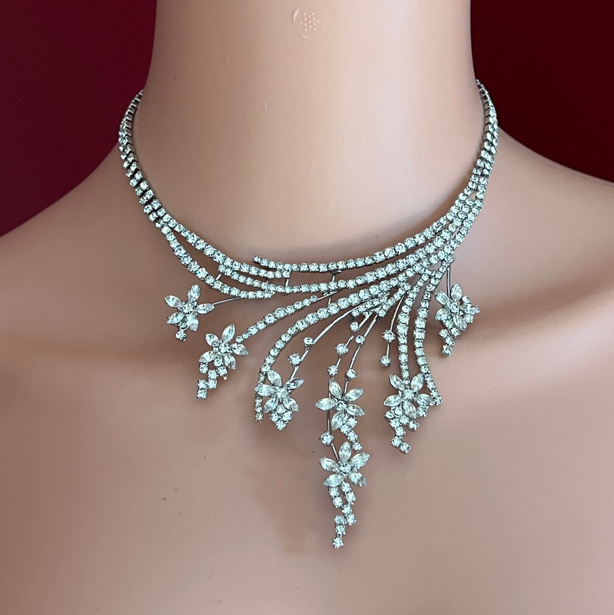 Vintage clear rhinestone bib necklace with cascading floral spray design