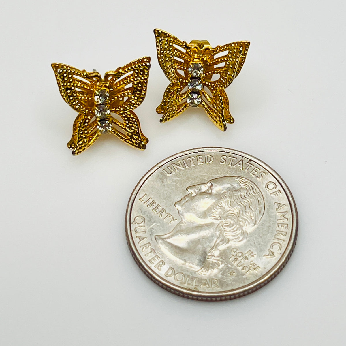 Vintage gold filigree butterfly stud earrings with rhinestone accents