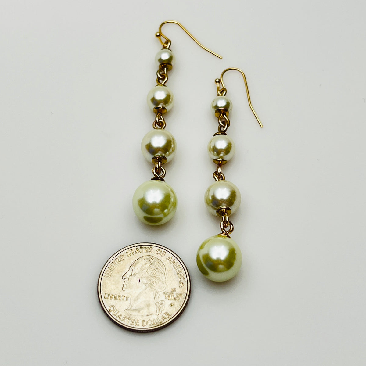 Vintage Lulu Frost long dangle earrings with graduated faux pearls on gold-tone wires