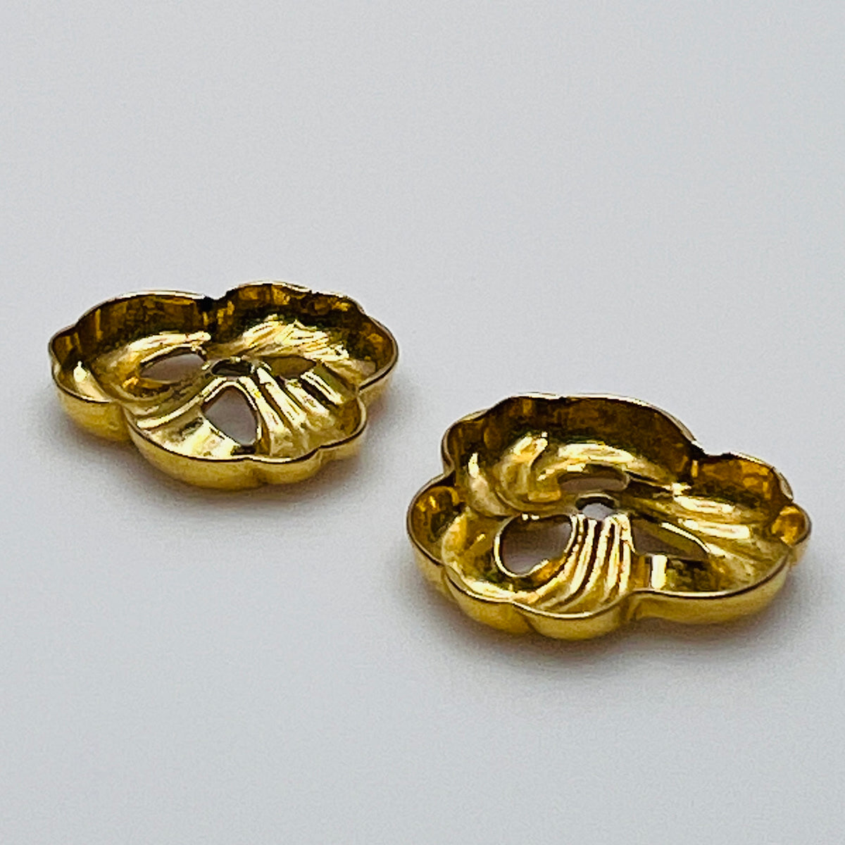 removable gold-tone swirl jackets