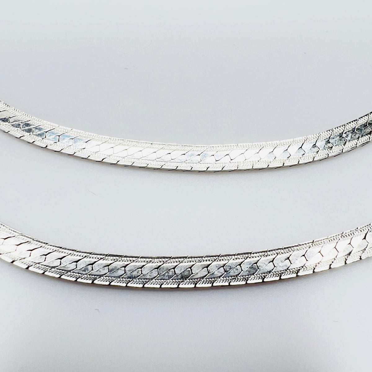 Detail of textured sterling silver snake chain links