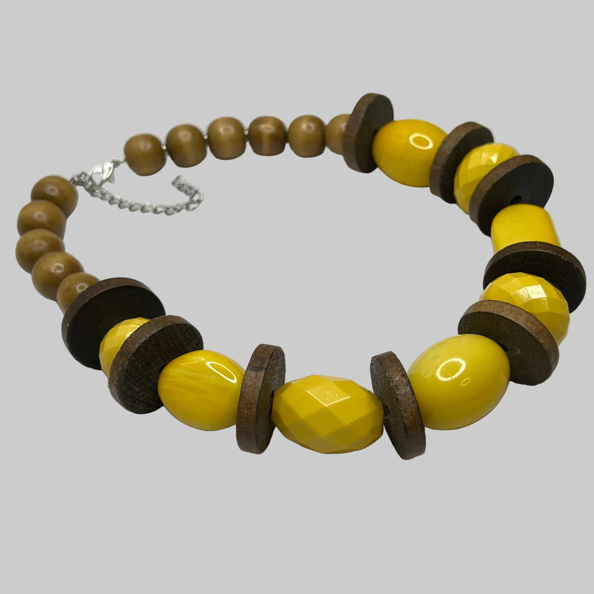 Detail of round wood neck beads and contrasting textures