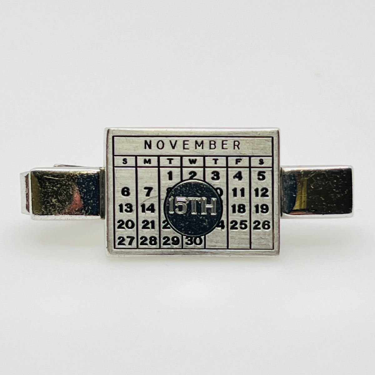 Vintage Anson cufflinks and tie clip set with November calendar design