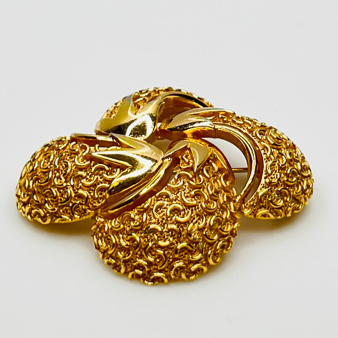 Side angle showing dimensional texture and sculpted swirl detailing