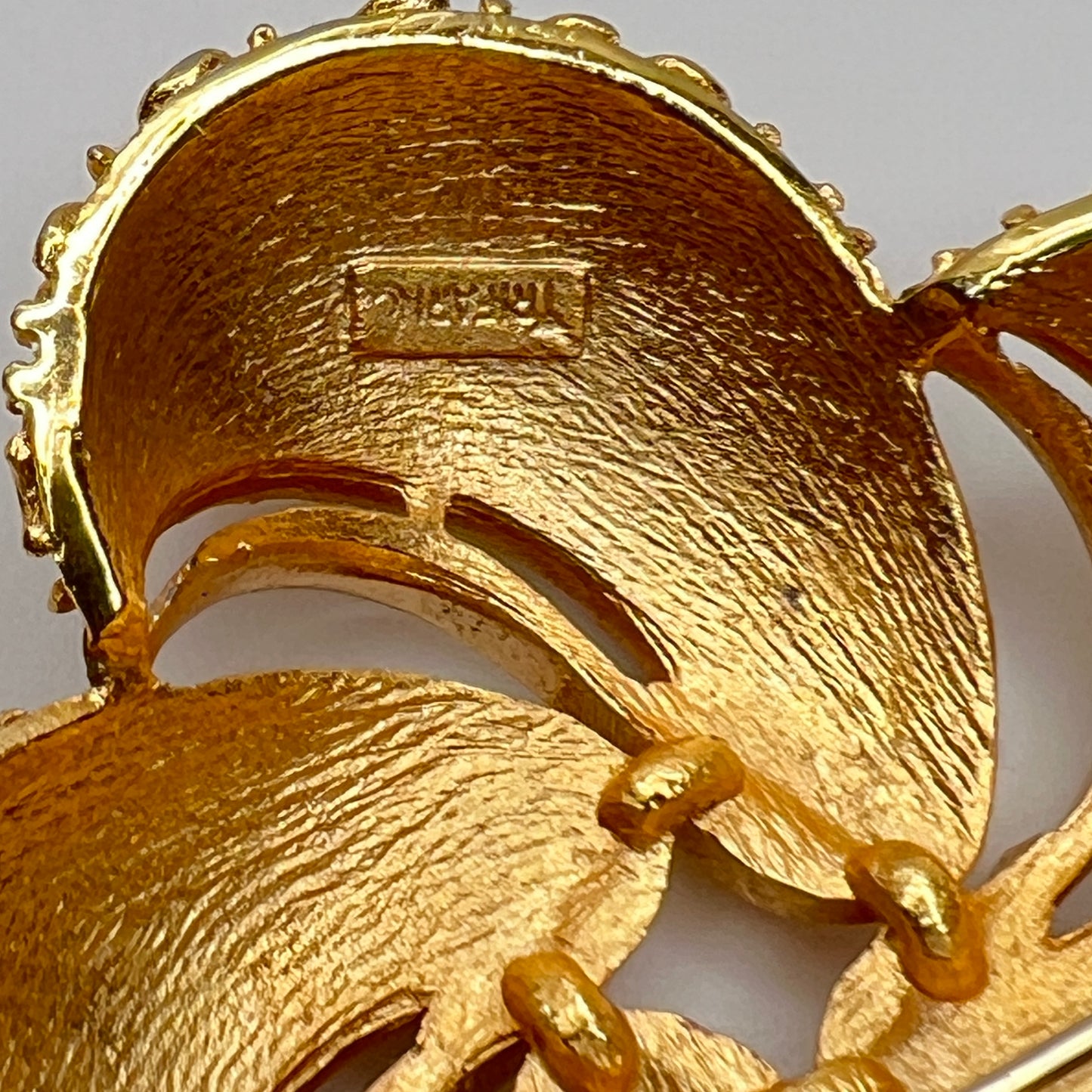 Close-up of Crown Trifari signature on reverse of brooch