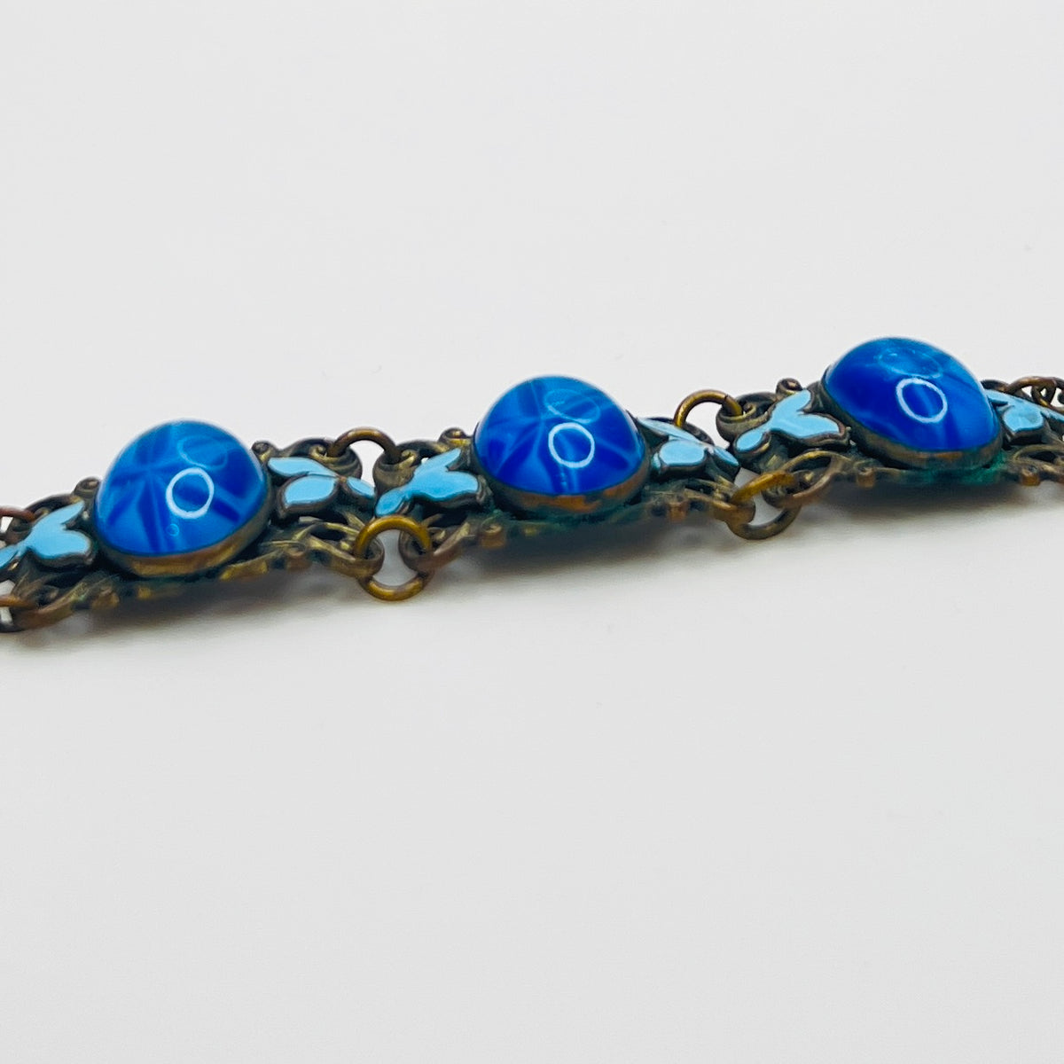 Vintage Czech starburst glass panel bracelet with enamel detail