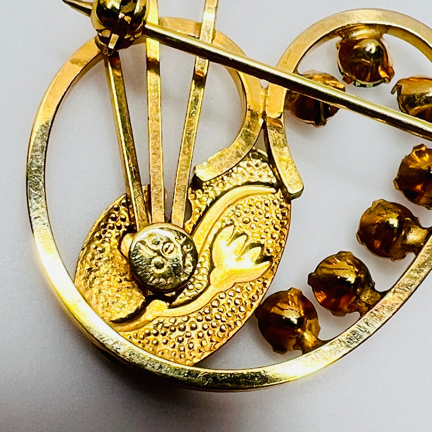 Reverse side showing DCE 14K gold-filled stamp and prong-set stones