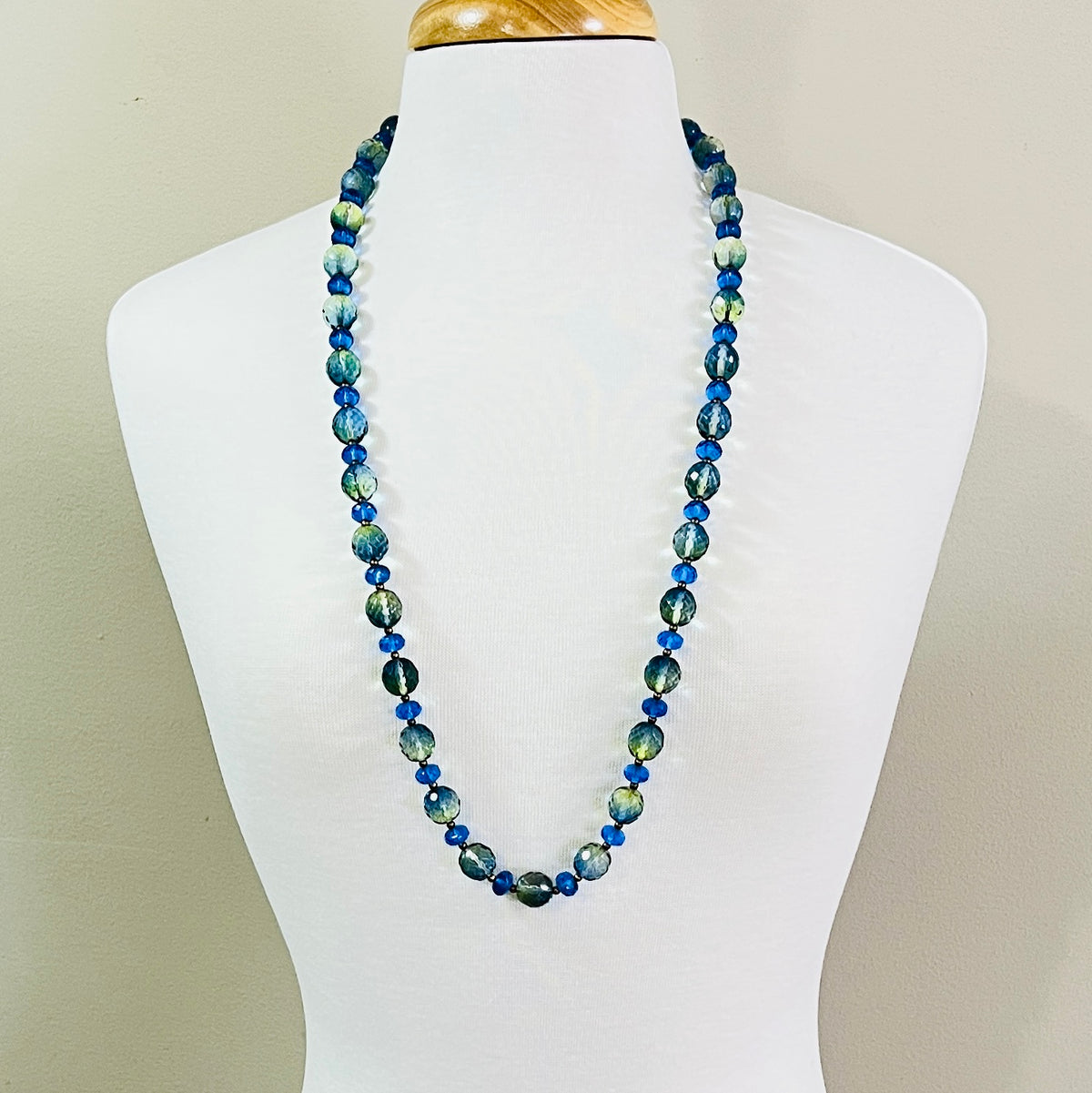 Full view of long Joan Rivers beaded necklace on display form