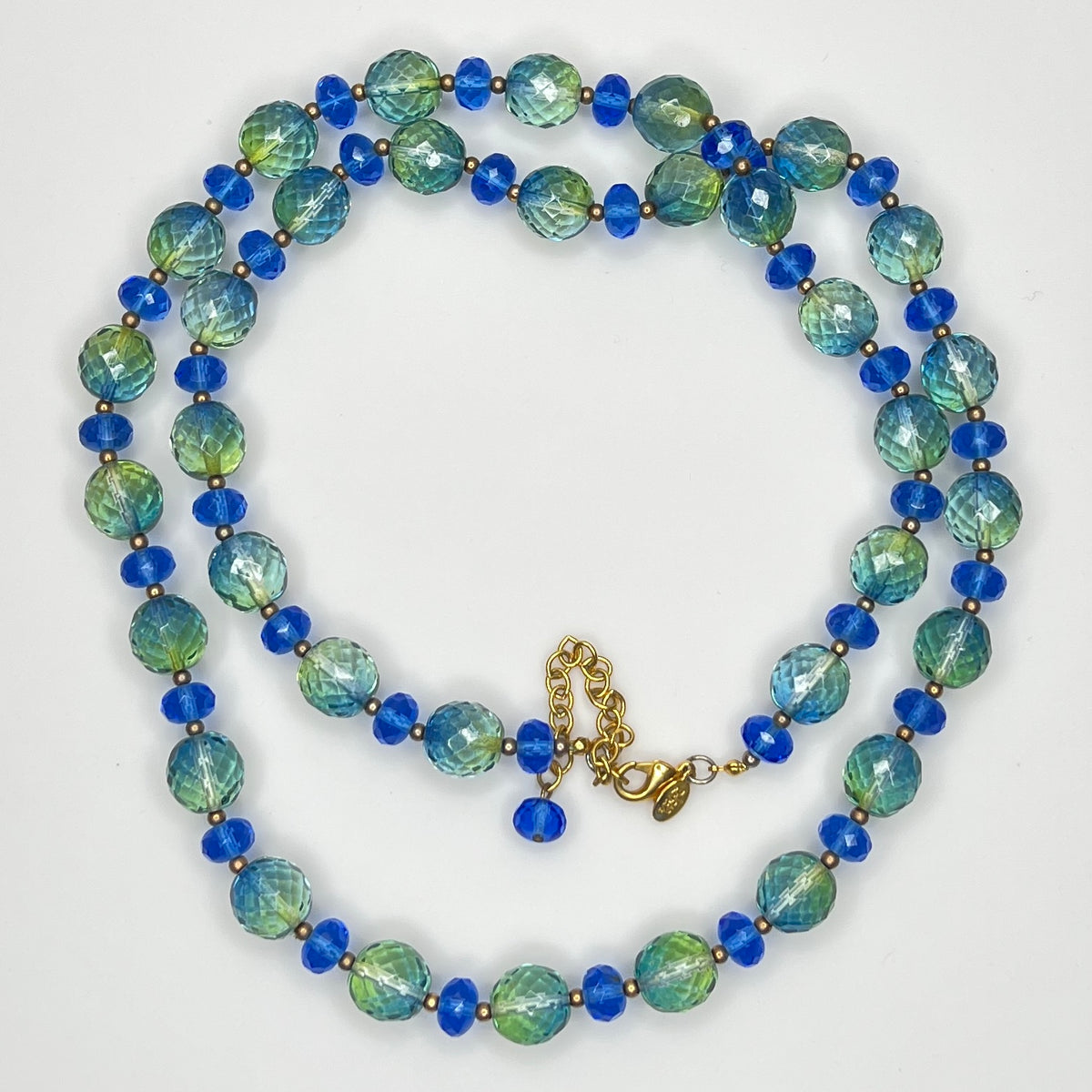 Coiled Joan Rivers necklace with gold-tone extender and clasp visible