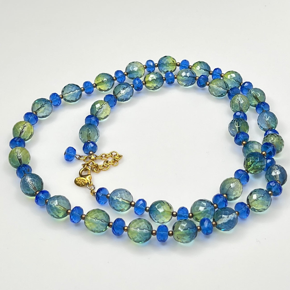 Coiled Joan Rivers necklace with gold-tone extender and clasp visible
