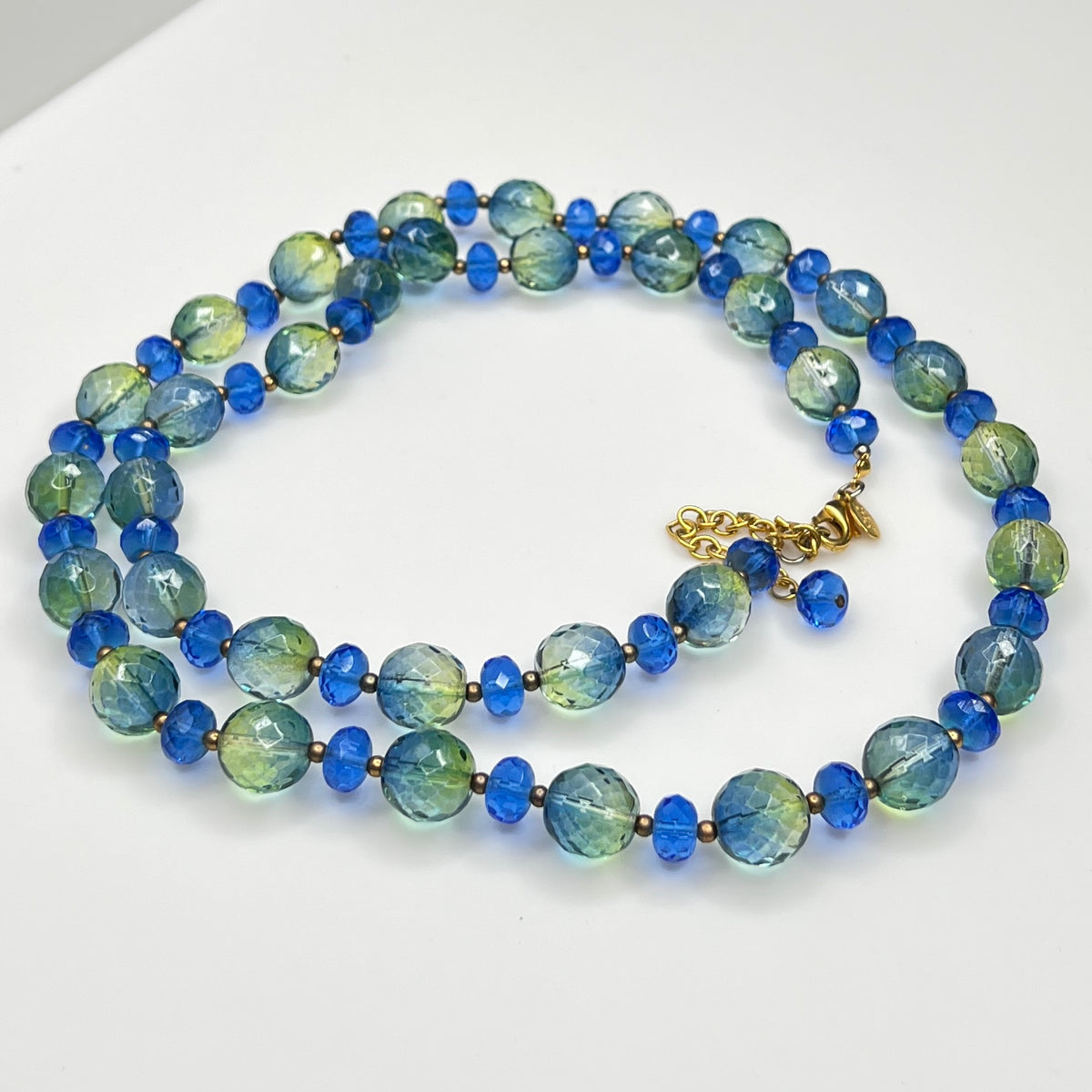 Coiled Joan Rivers necklace with gold-tone extender and clasp visible