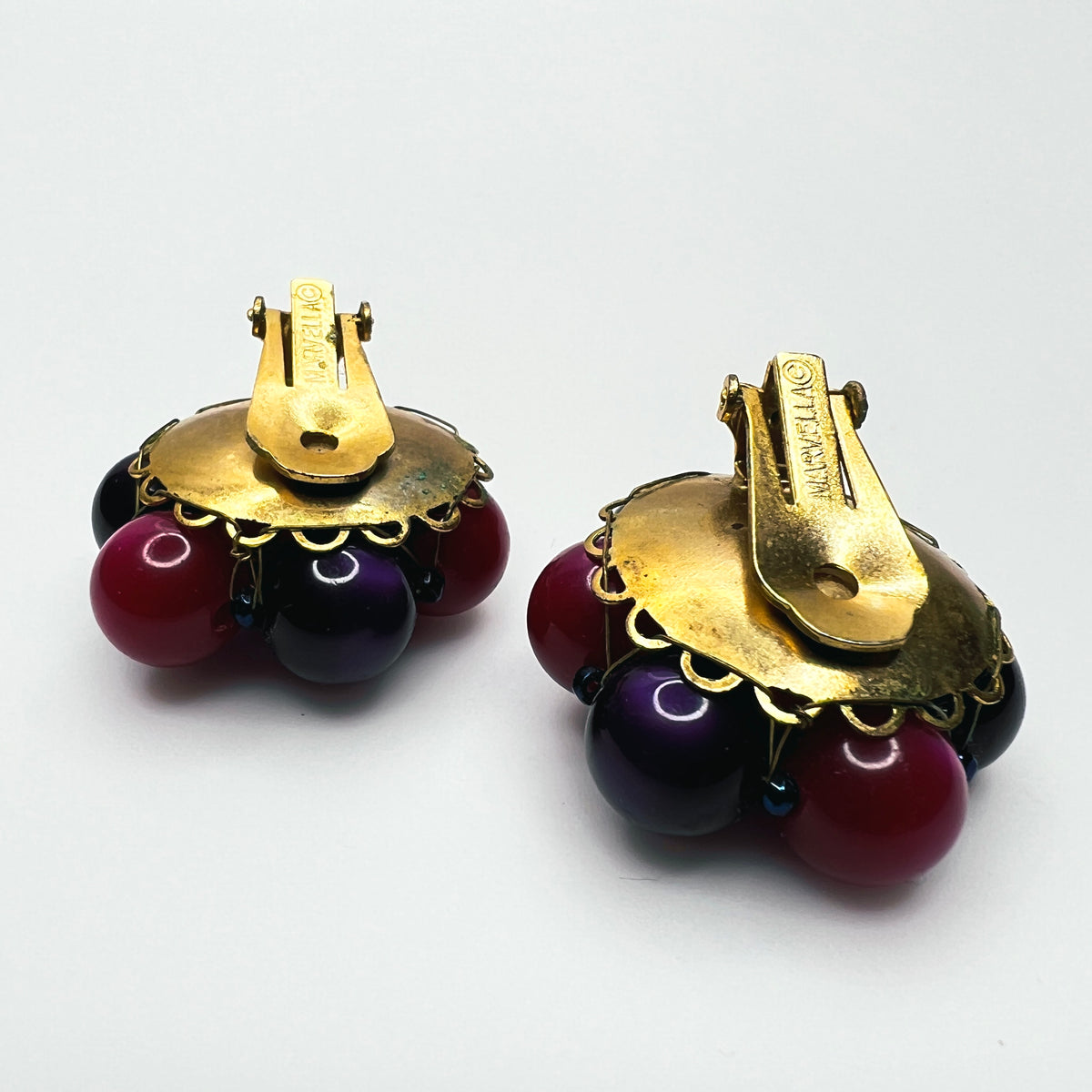 Reverse Side view of vintage Marvella dimensional bead cluster clip earrings with gold-tone metal settings.