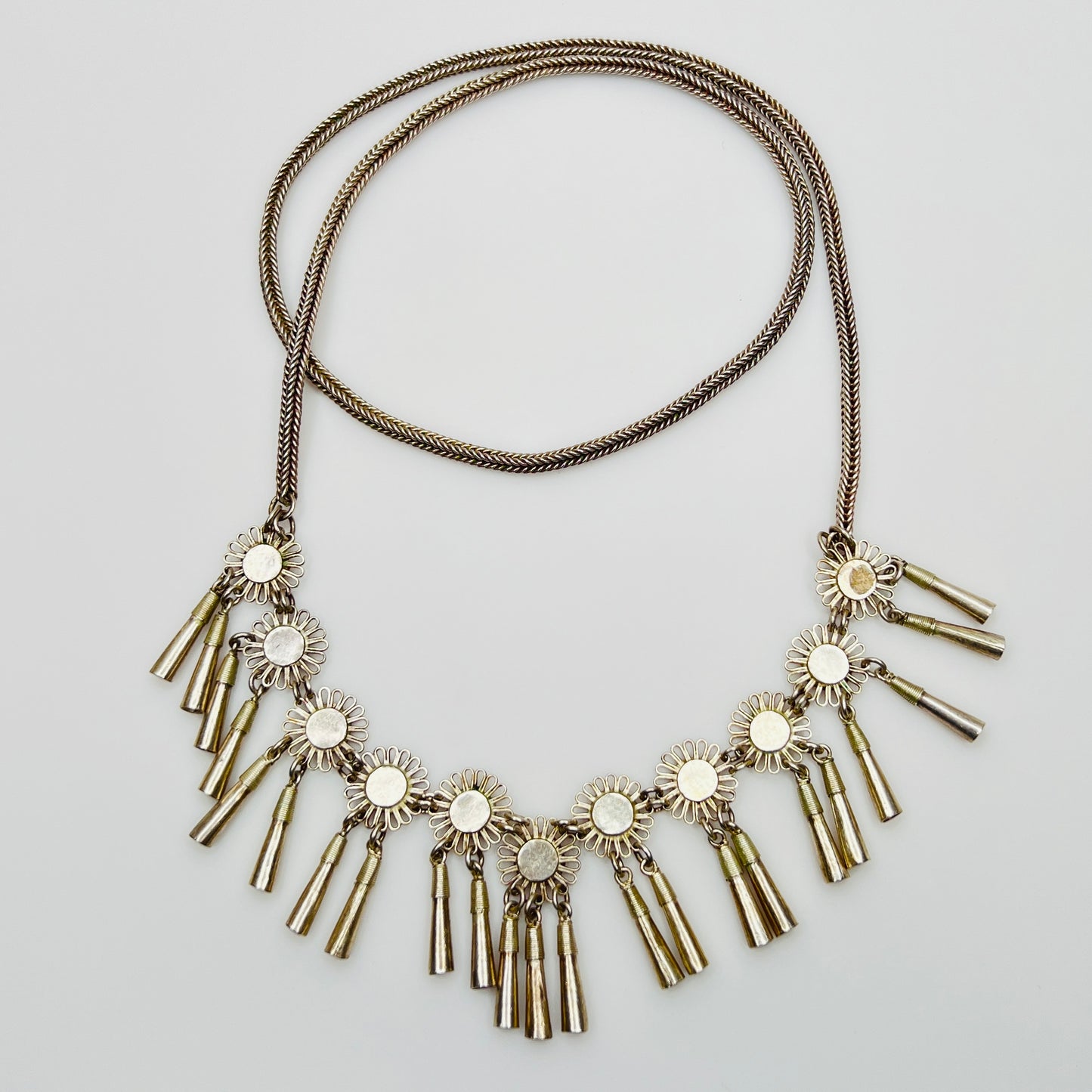 Vintage Miao Hmong silver tribal tassel necklace on display