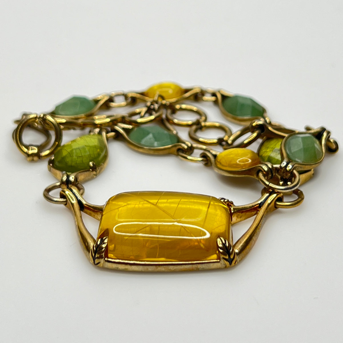 Vintage Monet necklace with green and yellow glass cabochons in gold-tone setting