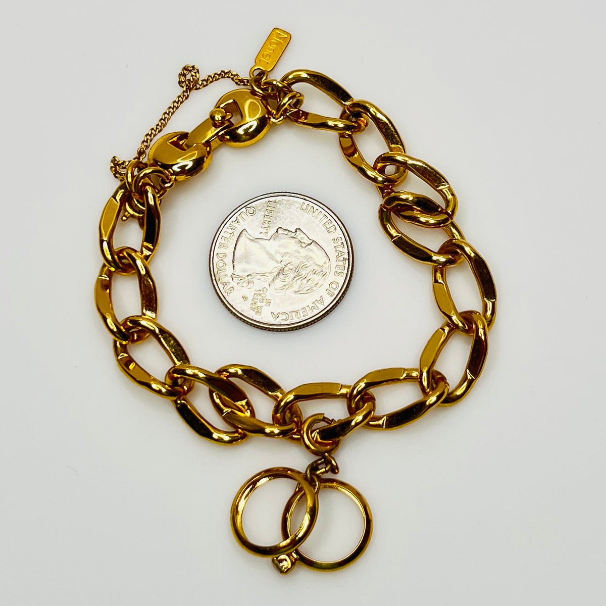 Gold-tone chain bracelet with rhinestone wedding ring charm by Monet