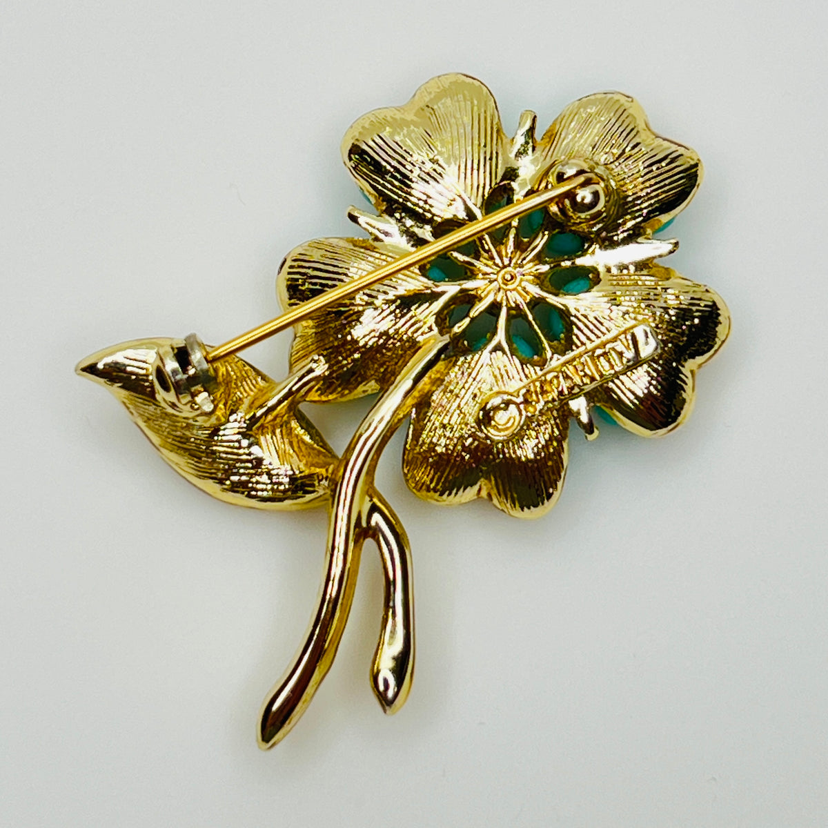1960s floral brooch with faux turquoise cabochons and pearl center