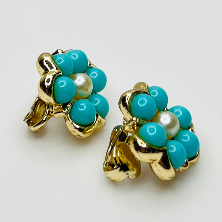 Matching clip-on earrings with gold-tone floral setting and turquoise beads