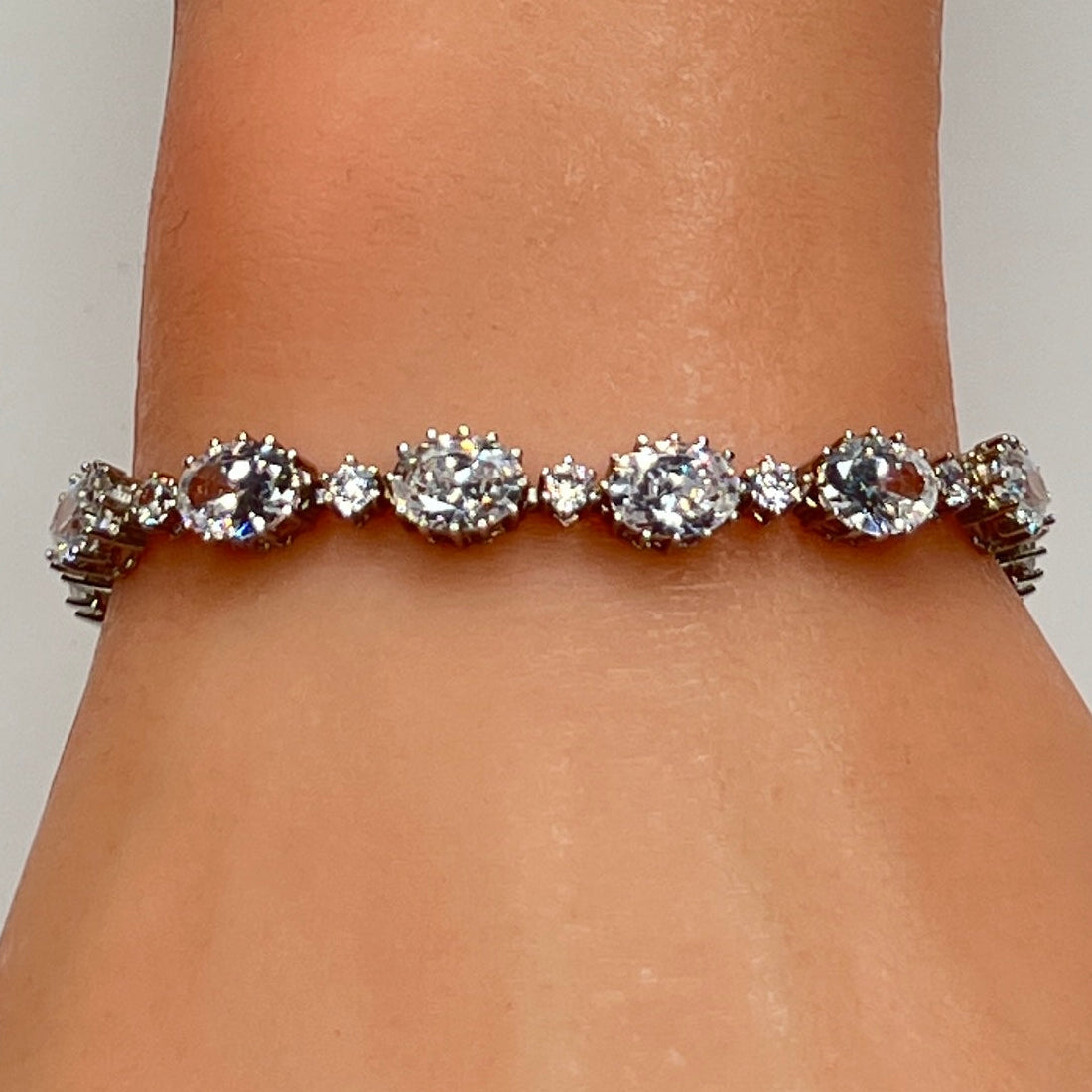 Stauer sterling silver CZ tennis bracelet on wrist