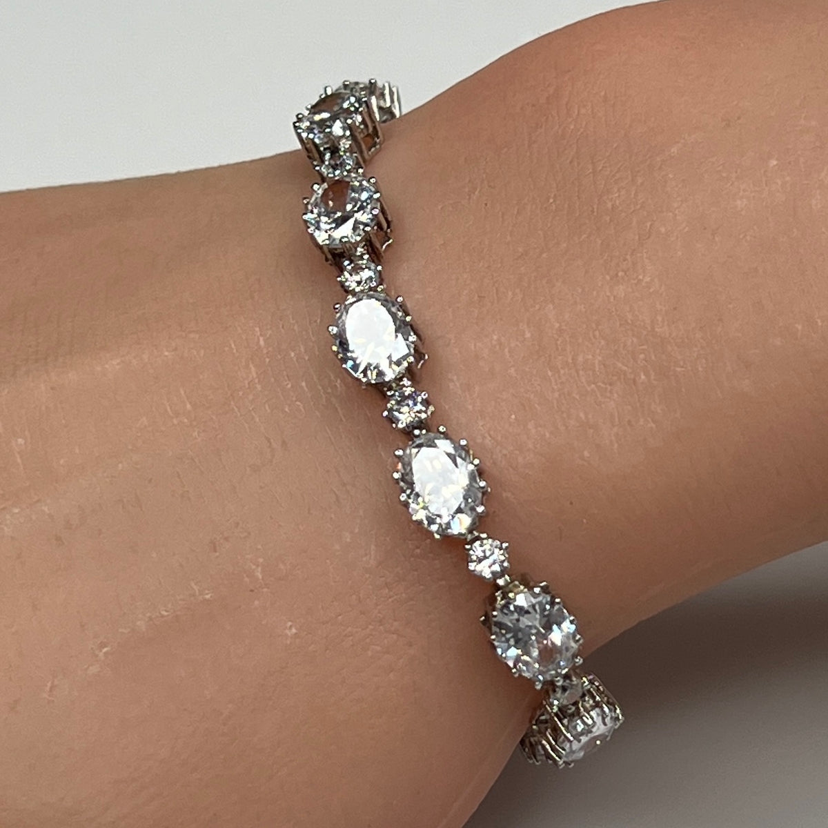 Stauer sterling silver CZ tennis bracelet on wrist