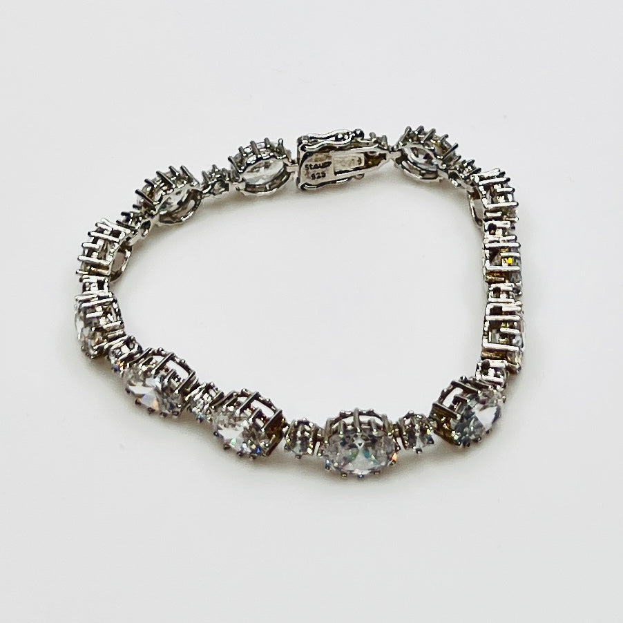 Full view of bracelet with alternating oval and round stones