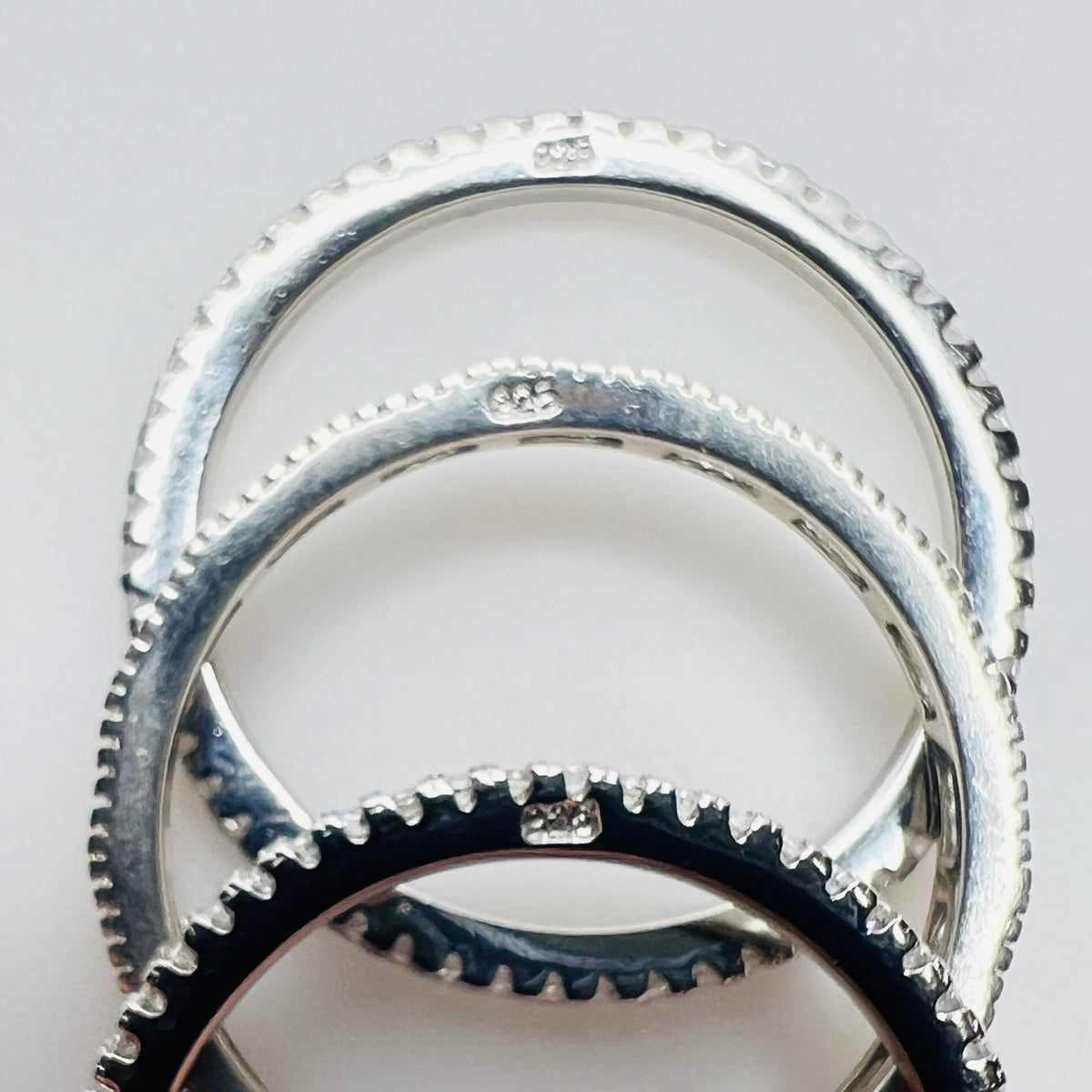 Underside view showing “925” stamp on each sterling band