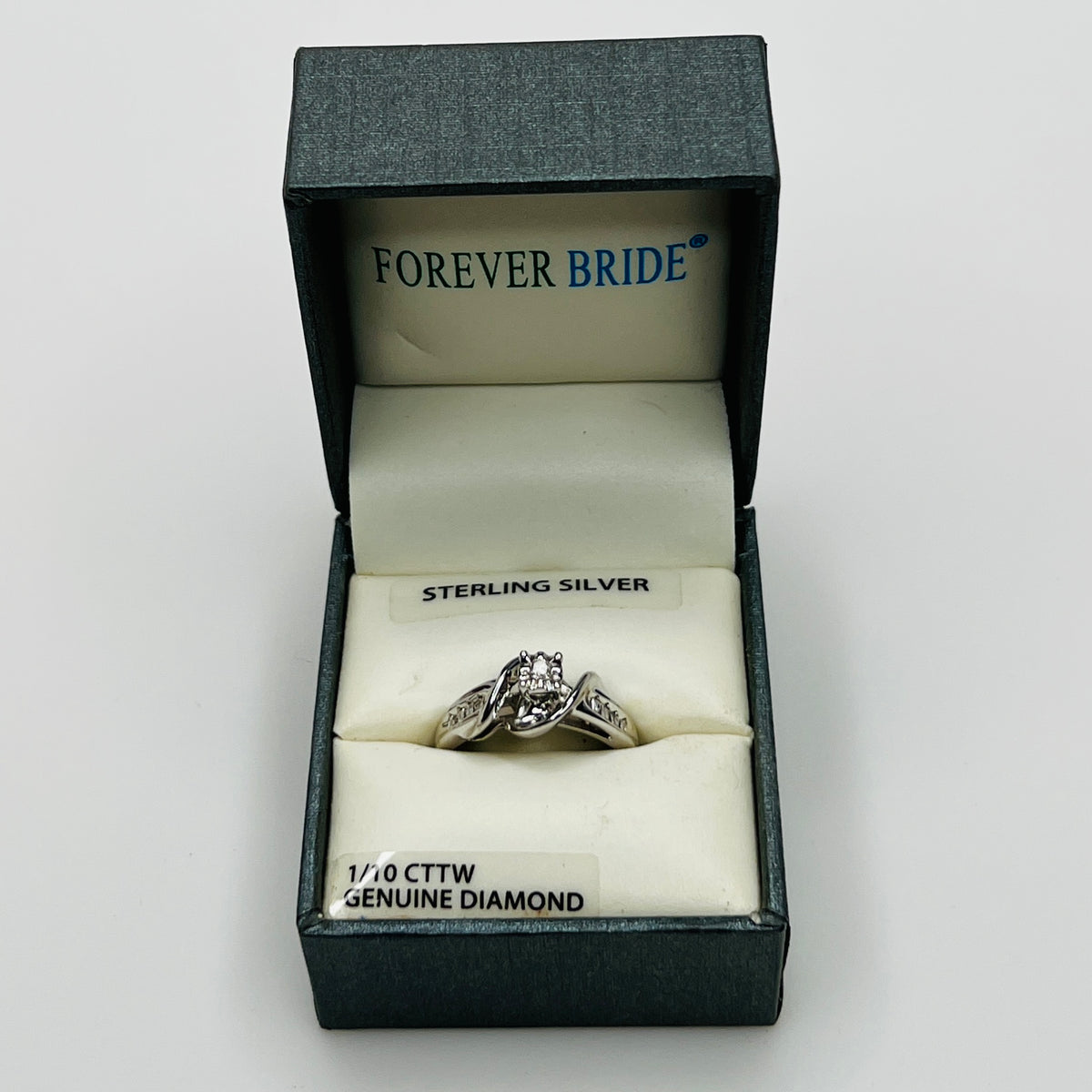 Ring in branded Forever Bride box with 1/10 CTTW diamond label