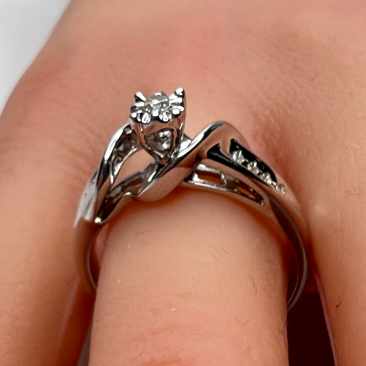 Sterling silver diamond ring by Forever Bride shown on finger