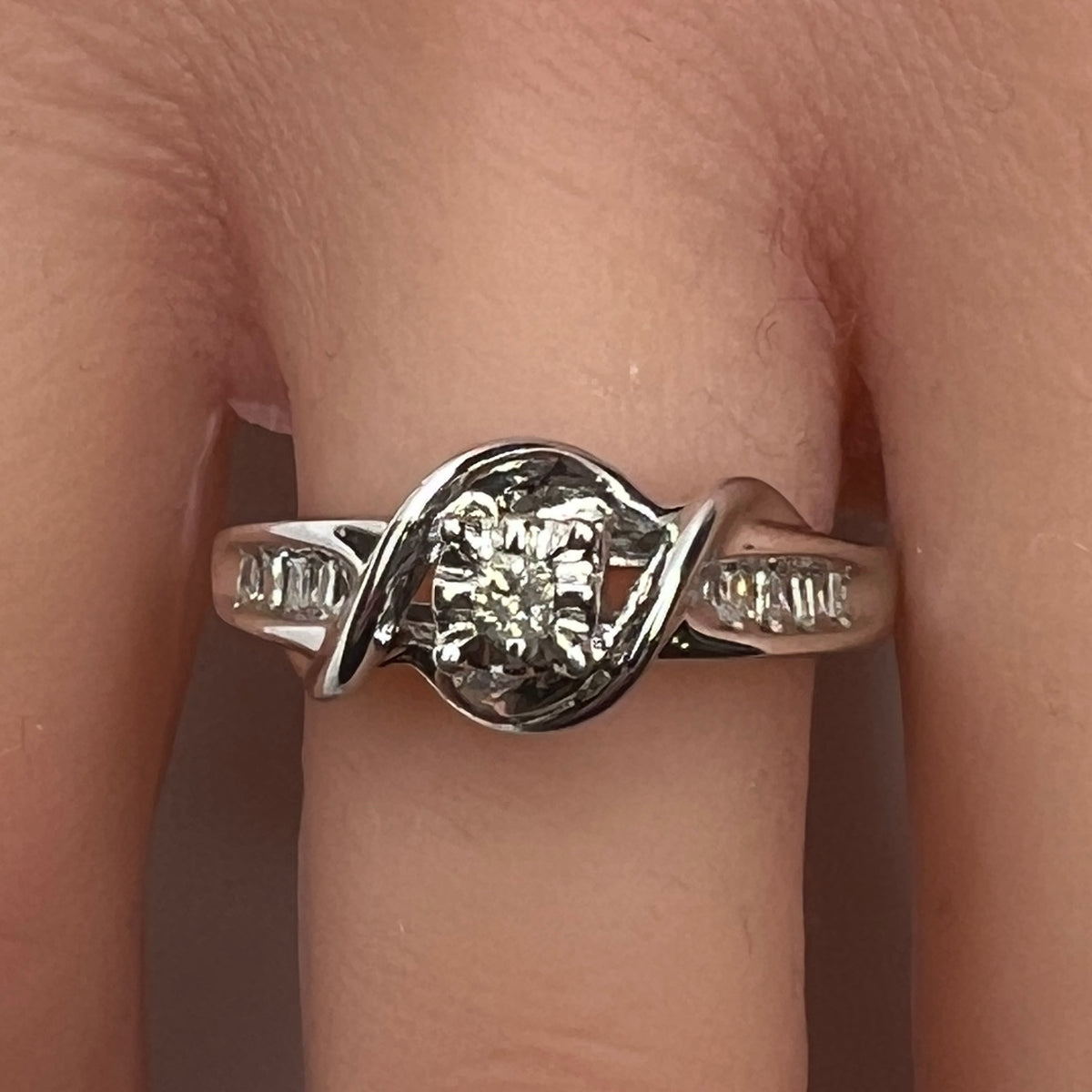 Sterling silver diamond ring by Forever Bride shown on finger