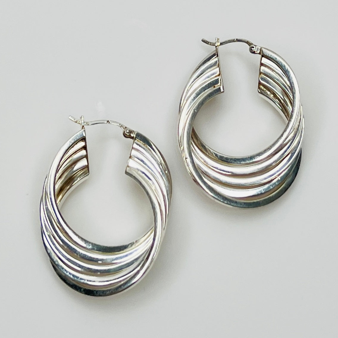1980s sterling silver layered hoop earrings, flat lay view