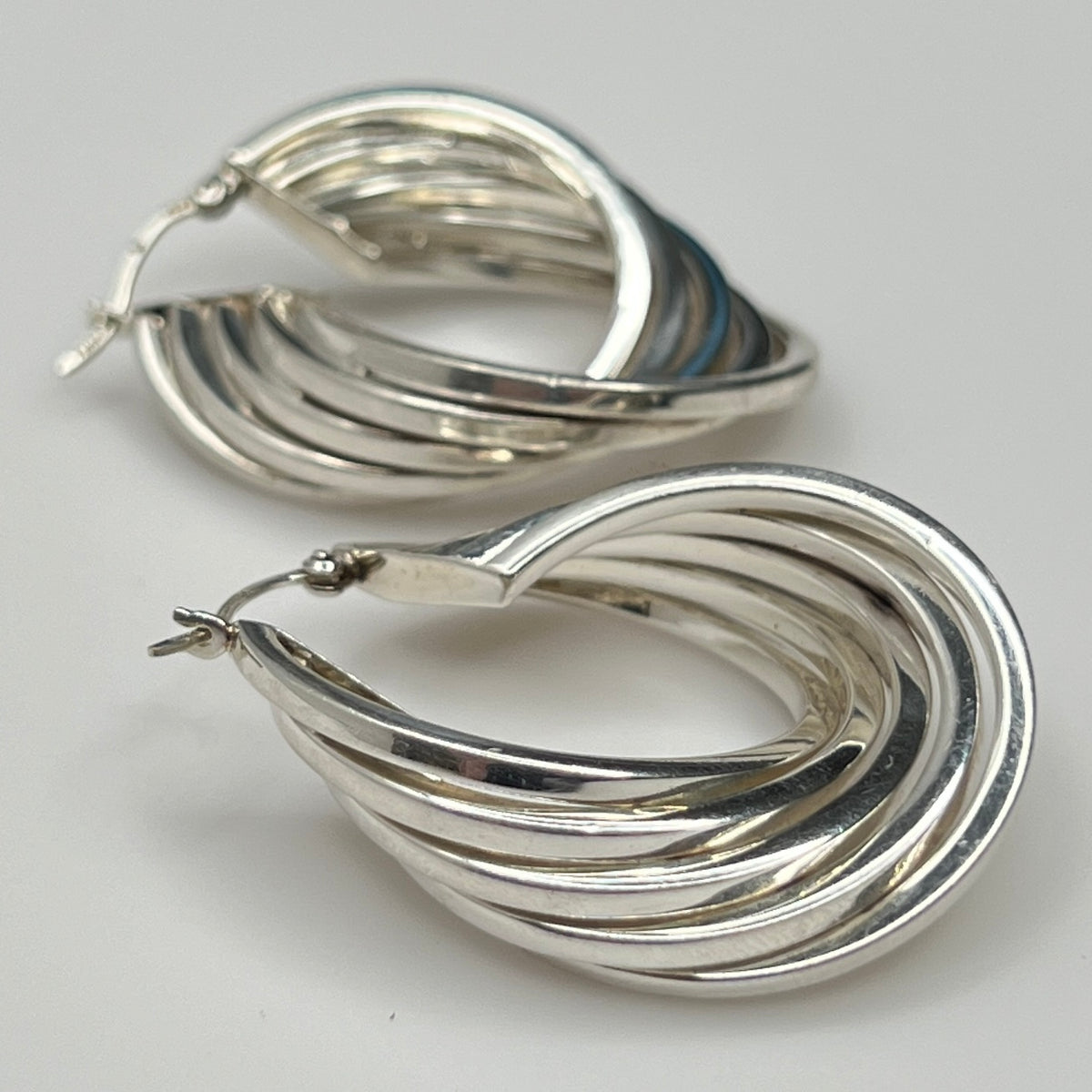 Side angle showing curved sterling hoop earring shape
