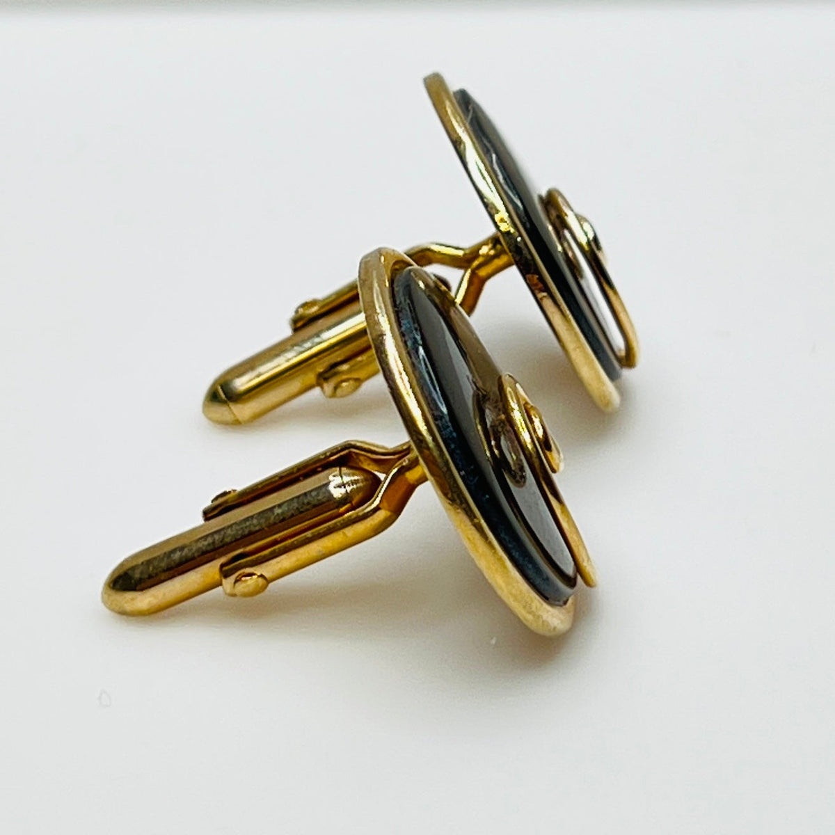 Round abalone cufflinks with gold swirl overlay, iridescent finish, 1960s Swank design
